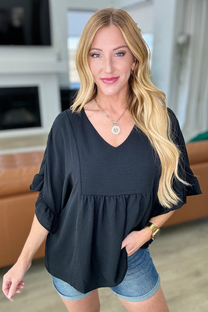 Airflow Peplum Ruffle Sleeve Top in Black-Tops-Timber Brooke Boutique, Online Women's Fashion Boutique in Amarillo, Texas